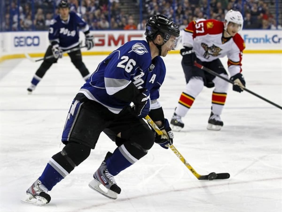 Martin St. Louis scores three goals to lead Lightning over