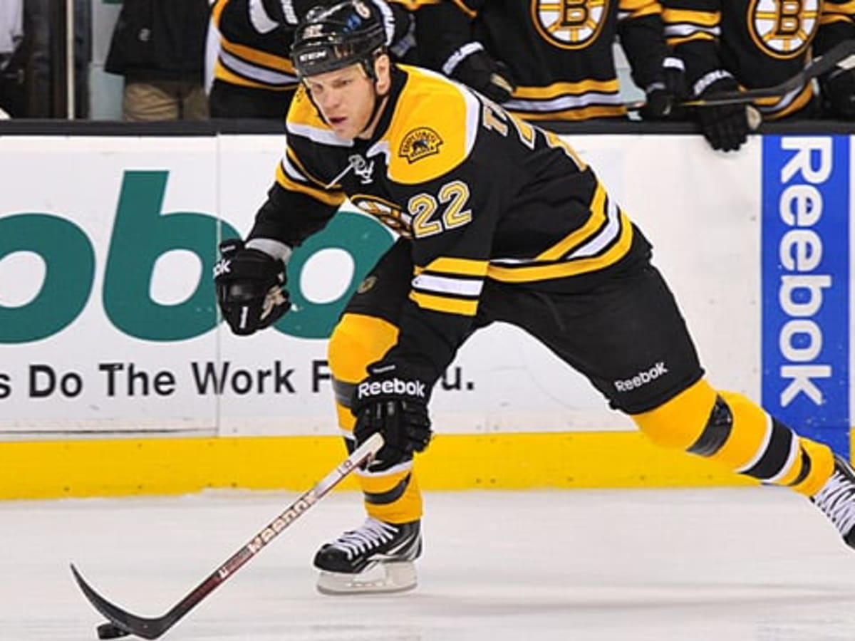 Boston Bruins player Shawn Thornton brings the Stanley Cup to