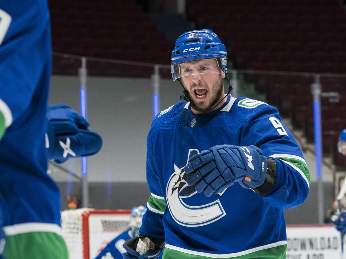Canucks' J.T. Miller reacts to fans throwing jerseys