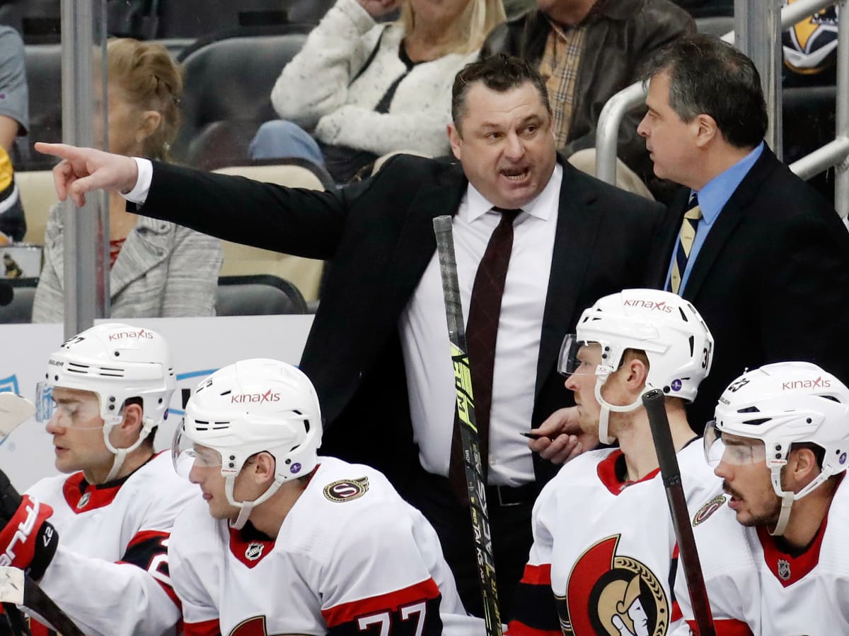 Ottawa Senators head coach D.J. Smith stands behind his bench during the  third period of an NHL hockey game against the Pittsburgh Penguins in  Pittsburgh, Thursday, Jan. 20, 2022. The Penguins won