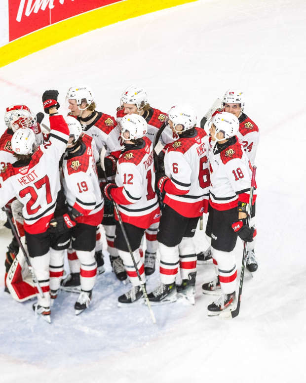 The Prince George Cougars celebrate a win over the Kamloops Blazers.