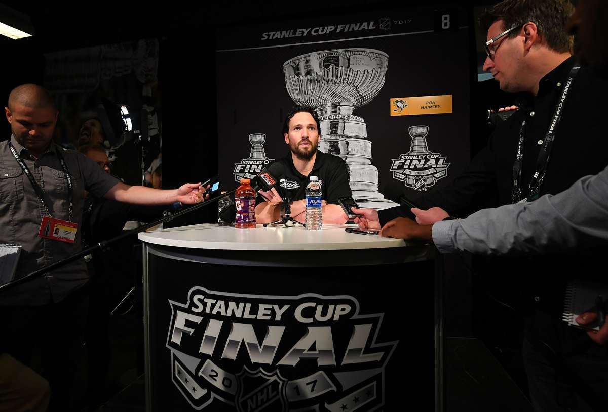 Ron-Hainsey-at-Stanley-Cup-podium.jpg