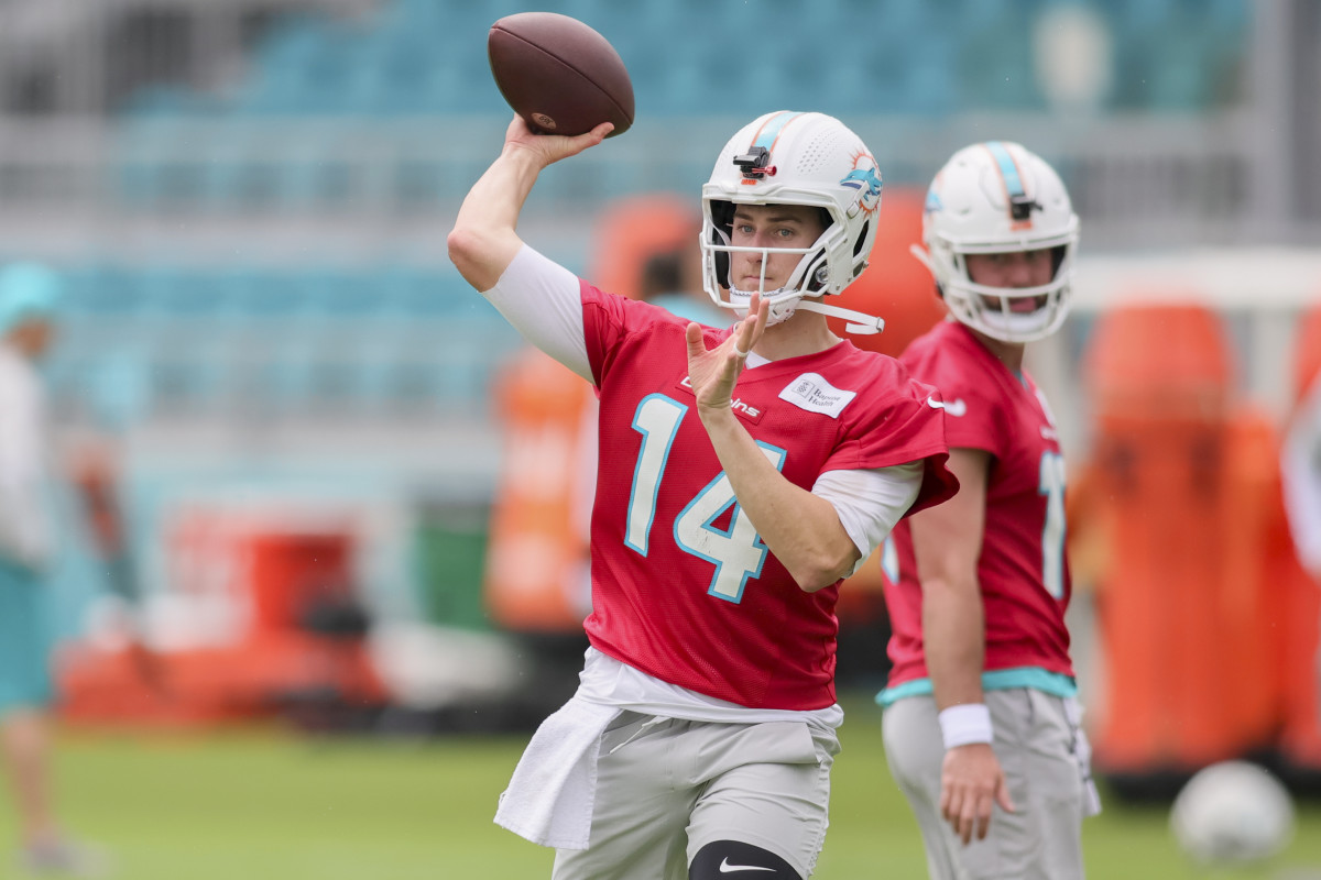 Miami Dolphins backup quarterback Mike White bangs a drum before