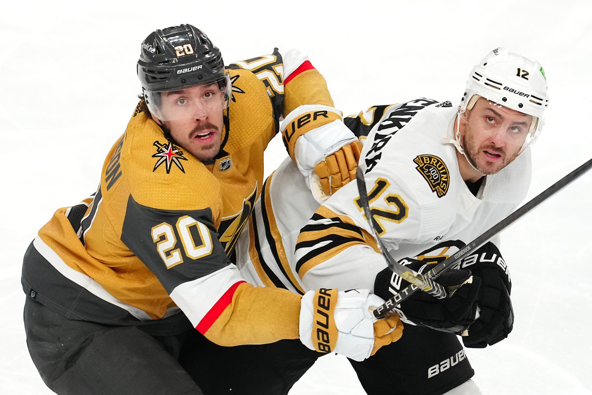 Jan 11, 2024; Las Vegas, Nevada, USA; Vegas Golden Knights center Chandler Stephenson (20) and Boston Bruins defenseman Kevin Shattenkirk (12) watch a flying puck during the third period at T-Mobile Arena. Mandatory Credit: Stephen R. Sylvanie-USA TODAY Sports