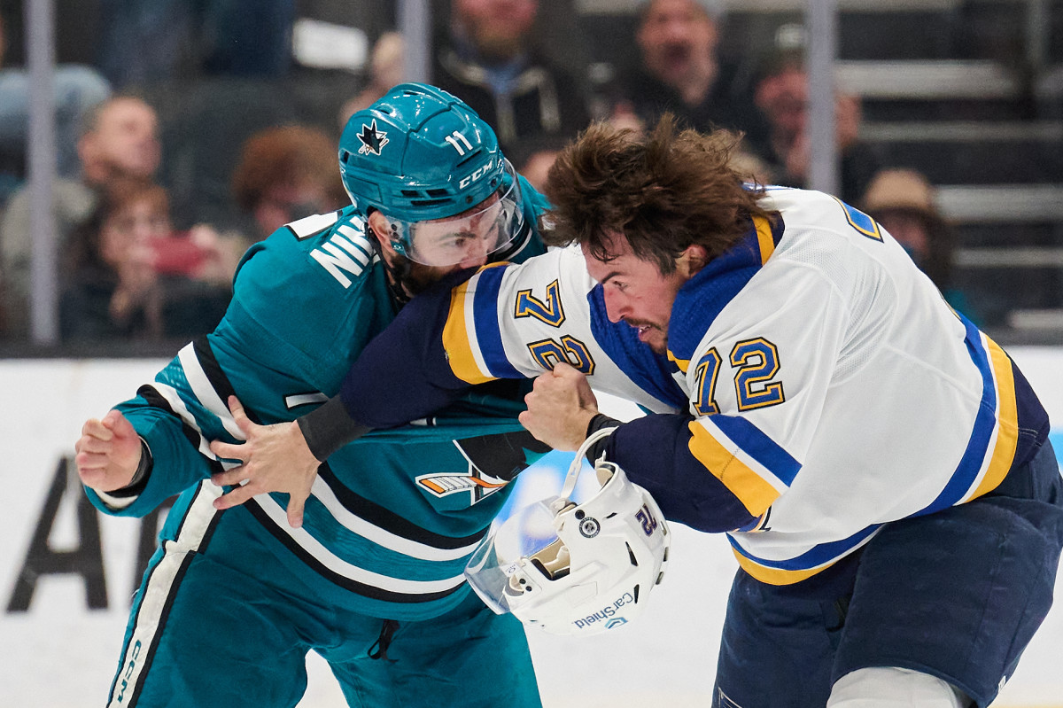 Blues defenseman Justin Faulk (72) was injured on this altercation with Chesterfield native and Sharks forward Luke Kunin on Saturday.