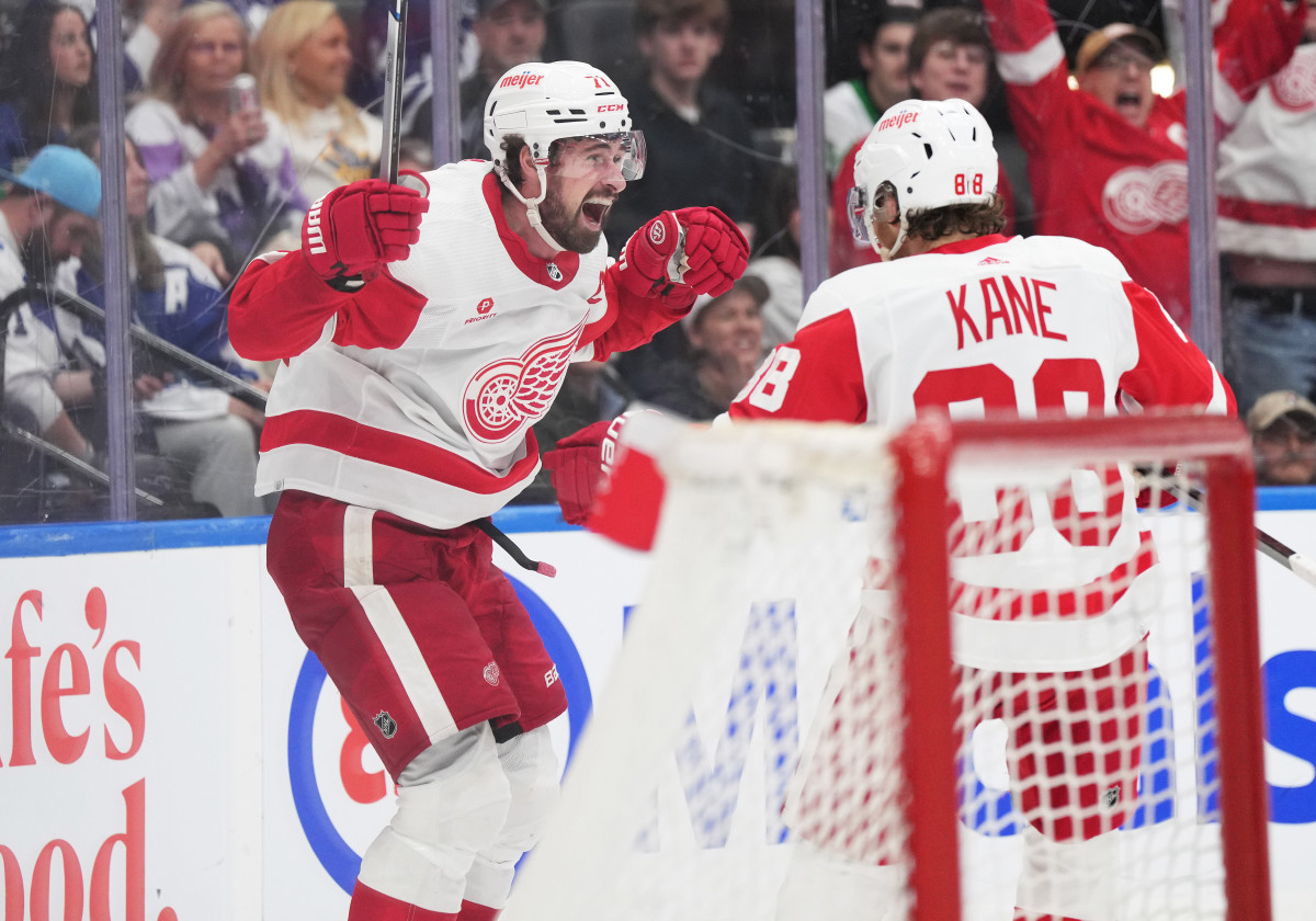 Detroit Red Wings center Dylan Larkin (71) scores the winning goal and celebrates with right wing Patrick Kane (88) against the Toronto Maple Leafs