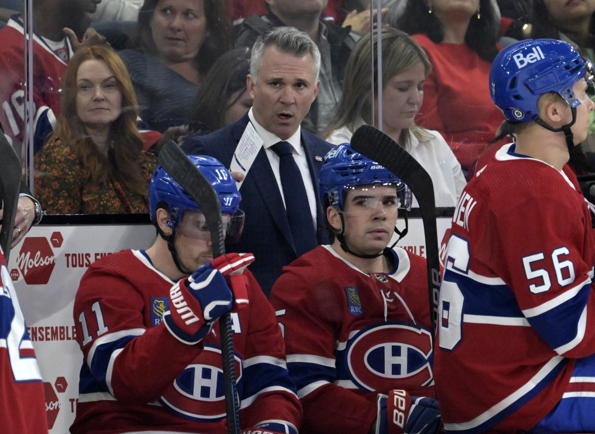 Feb 21, 2024; Montreal, Quebec, CAN; Montreal Canadiens head coach Martin St-Louis behind the bench during the first period of the game against the Buffalo Sabres at the Bell Centre. Mandatory Credit: Eric Bolte-USA TODAY Sports