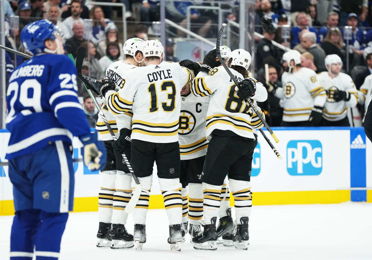 Apr 27, 2024; Toronto, Ontario, CAN; Boston Bruins left wing Brad Marchand (63) scores a goal and celebrates with center Charlie Coyle (13) against the Toronto Maple Leafs during the second period in game four of the first round of the 2024 Stanley Cup Playoffs at Scotiabank Arena. Mandatory Credit: Nick Turchiaro-USA TODAY