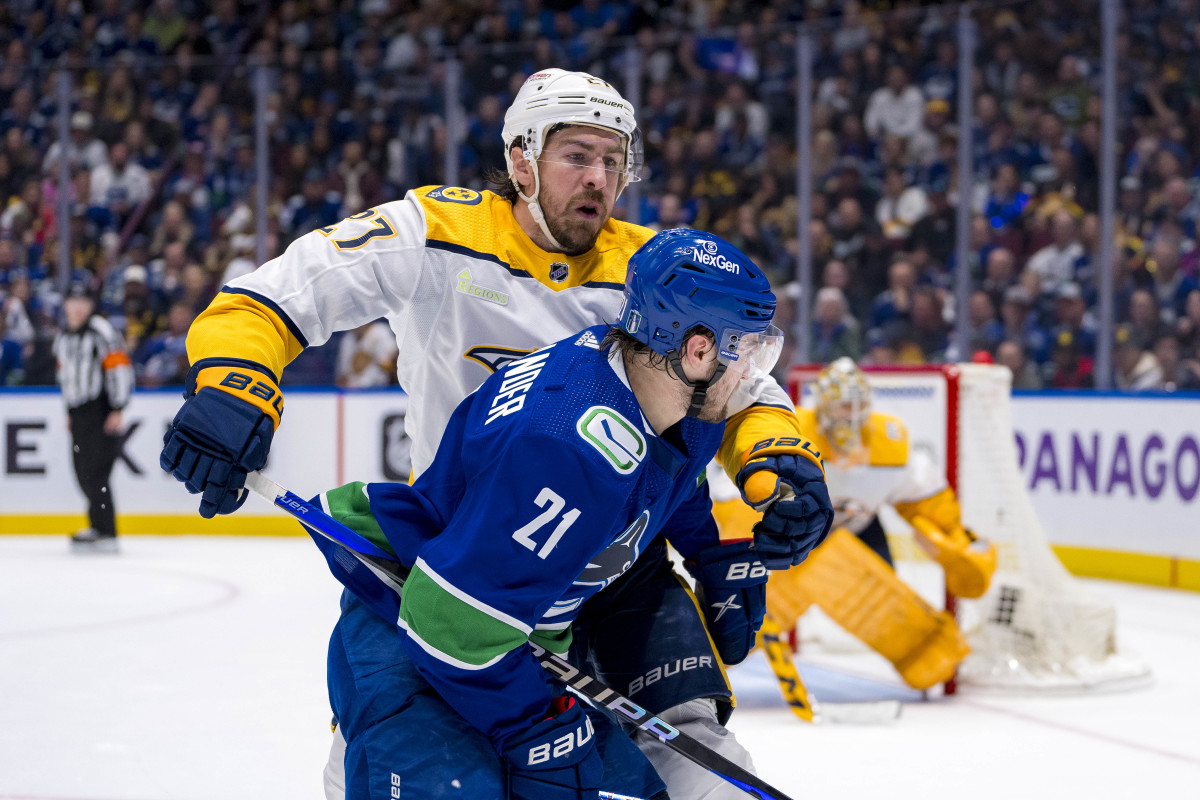 Apr 30, 2024; Vancouver, British Columbia, CAN; Nashville Predators defenseman Ryan McDonagh (27) checks Vancouver Canucks forward Nils Hoglander (21) during the third period in game five of the first round of the 2024 Stanley Cup Playoffs at Rogers Arena. Mandatory Credit: Bob Frid-USA TODAY Sports