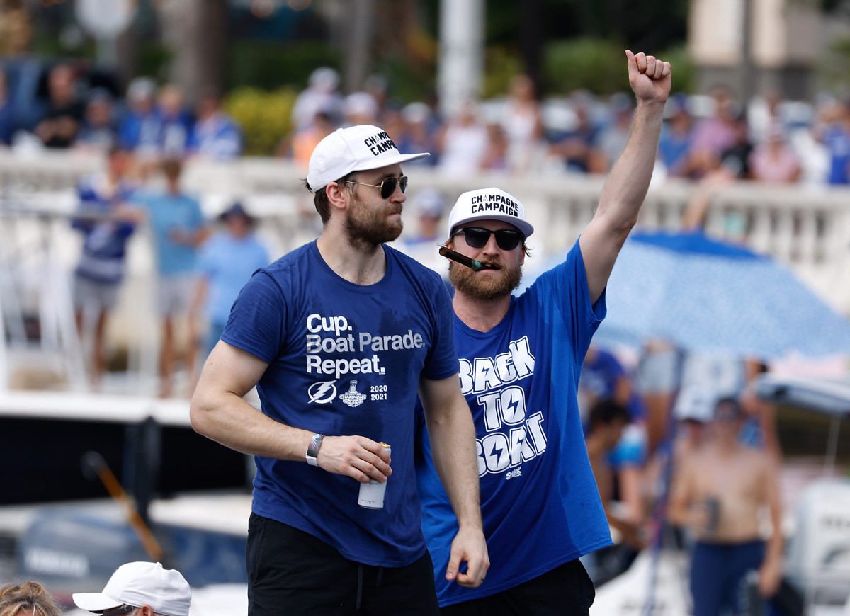 Jul 12, 2021; Tampa, FL, USA; Tampa Bay Lightning center Steven Stamkos (91) and defenseman Victor Hedman (77) celebrate on a boat during the Stanley Cup Championship parade. 