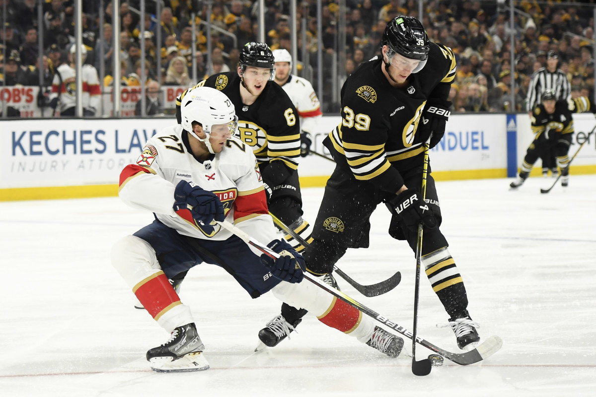 May 12, 2024; Boston, Massachusetts, USA; Florida Panthers center Eetu Luostarinen (27) and Boston Bruins center Morgan Geekie (39) battle for the puck during the second period in game four of the second round of the 2024 Stanley Cup Playoffs at TD Garden. Mandatory Credit: Bob DeChiara-USA TODAY Sports