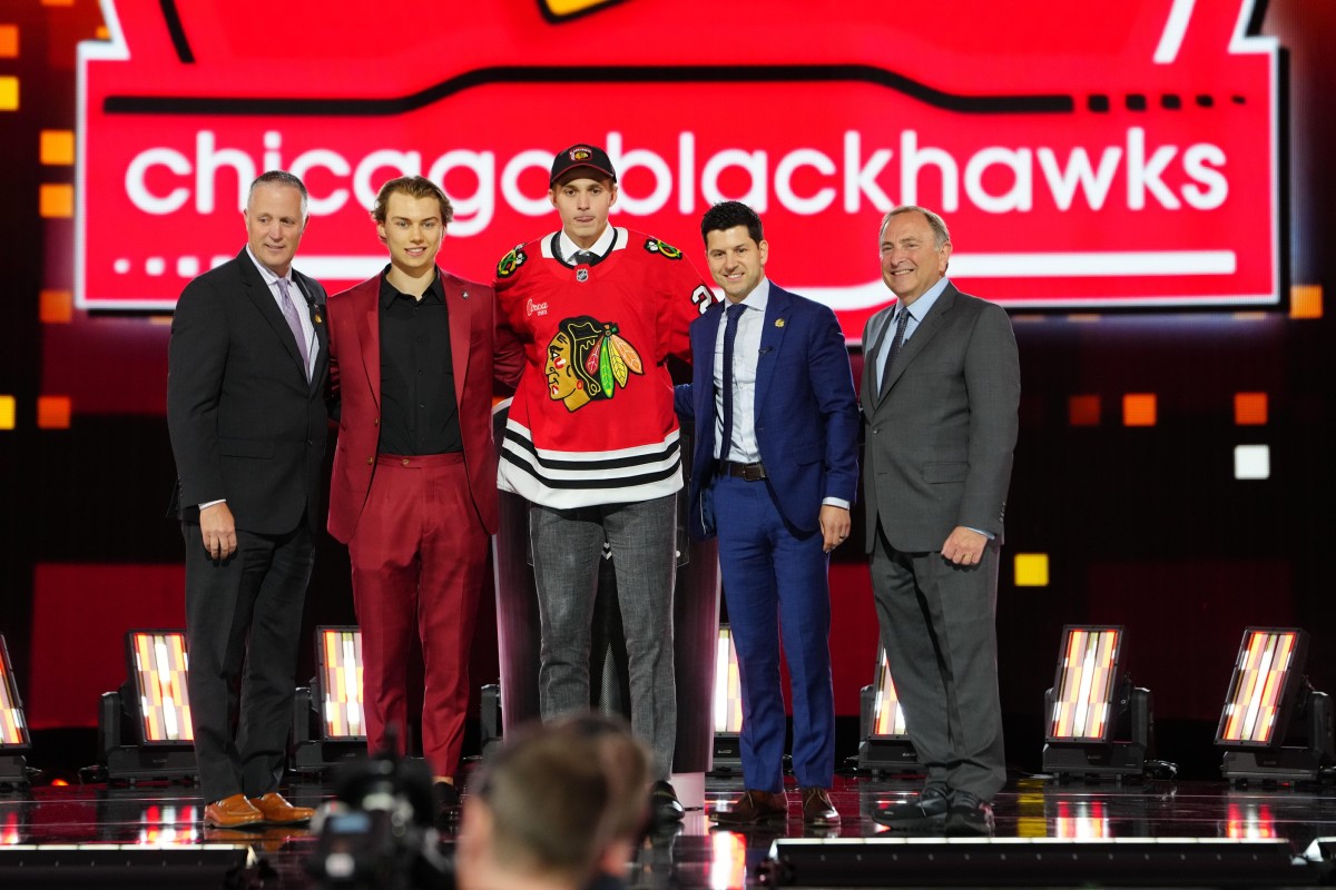 Artyom Levshunov (center) poses with Connor Bedard (left) at after being selected in the No. 2 overall slot by the Blackhawks at the 2024 Upper Deck NHL Draft.