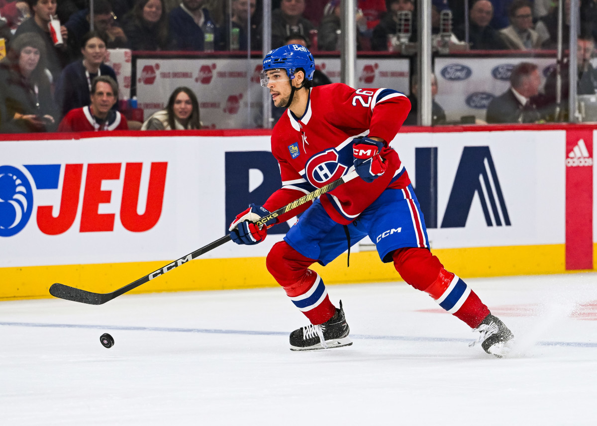 Oct 21, 2023; Montreal, Quebec, CAN; Montreal Canadiens defenseman Johnathan Kovacevic (26) plays the puck against the Washington Capitals during the second period at Bell Centre. Mandatory Credit: David Kirouac-USA TODAY Sports