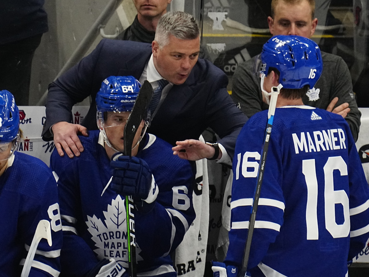 May 2, 2022; Toronto, Ontario, CAN; Toronto Maple Leafs head coach Sheldon Keefe congratulates forward Mitchell Marner (16) and forward David Kampf (64) after his goal against the Tampa Bay Lightning during the second period of game one of the first round of the 2022 Stanley Cup Playoffs at Scotiabank Arena. Mandatory Credit: John E. Sokolowski-USA TODAY Sports