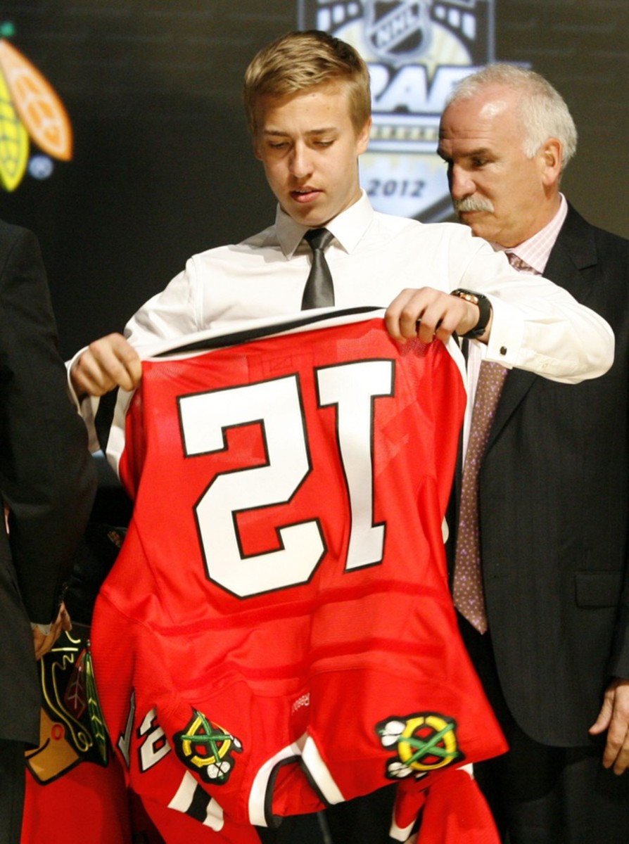 Teuvo Teravainen at the 2012 NHL draft as former Blackhawks coach Joel Quenneville looks on