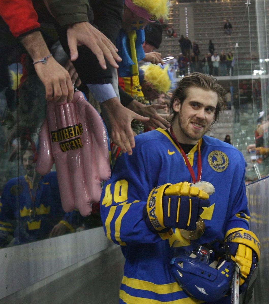 Henrik Zetterberg is congratulated by fans after Sweden celebrates after beating Finland, 3-2, in the gold medal round during the 2006 Torino Winter Olympics on Feb. 26, 2006