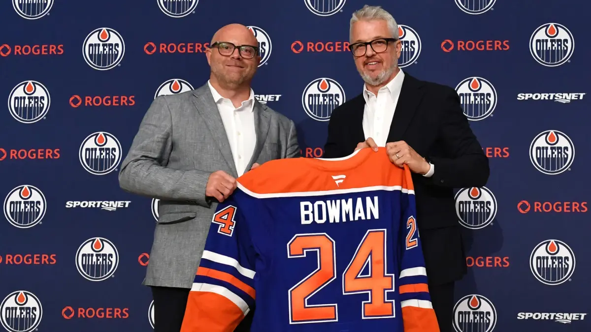 Stan Bowman (left) at press conference after being announced as Edmonton Oilers GM and executive VP.