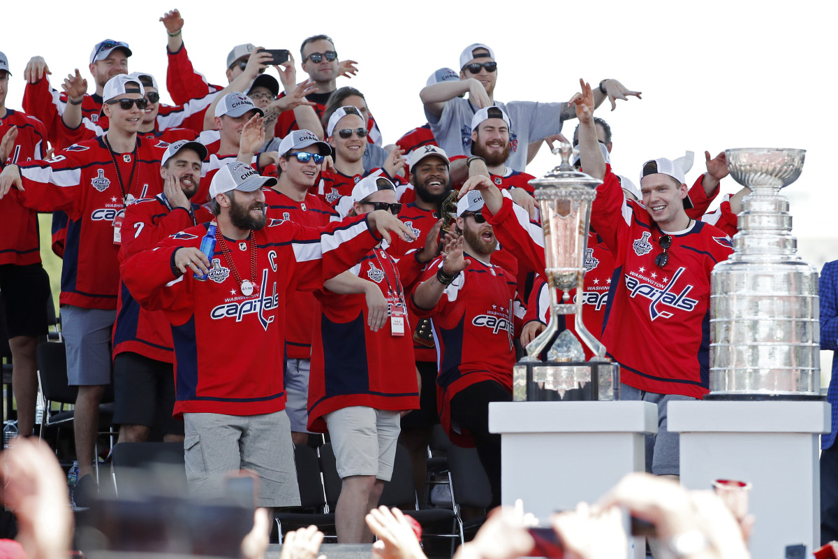 Jun 12, 2018; Washington, DC, USA; Washington Capitals players do the "Bird Dance" as Capitals center Evgeny Kuznetsov (R) is introduced during the Stanley Cup championship parade and celebration on the National Mall