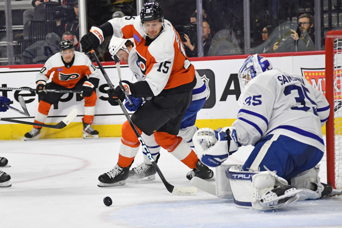 Philadelphia Flyers right wing Denis Gurianov (15) battles for the puck against Toronto Maple Leafs goaltender Ilya Samsonov (35) during the first period at Wells Fargo Center. 