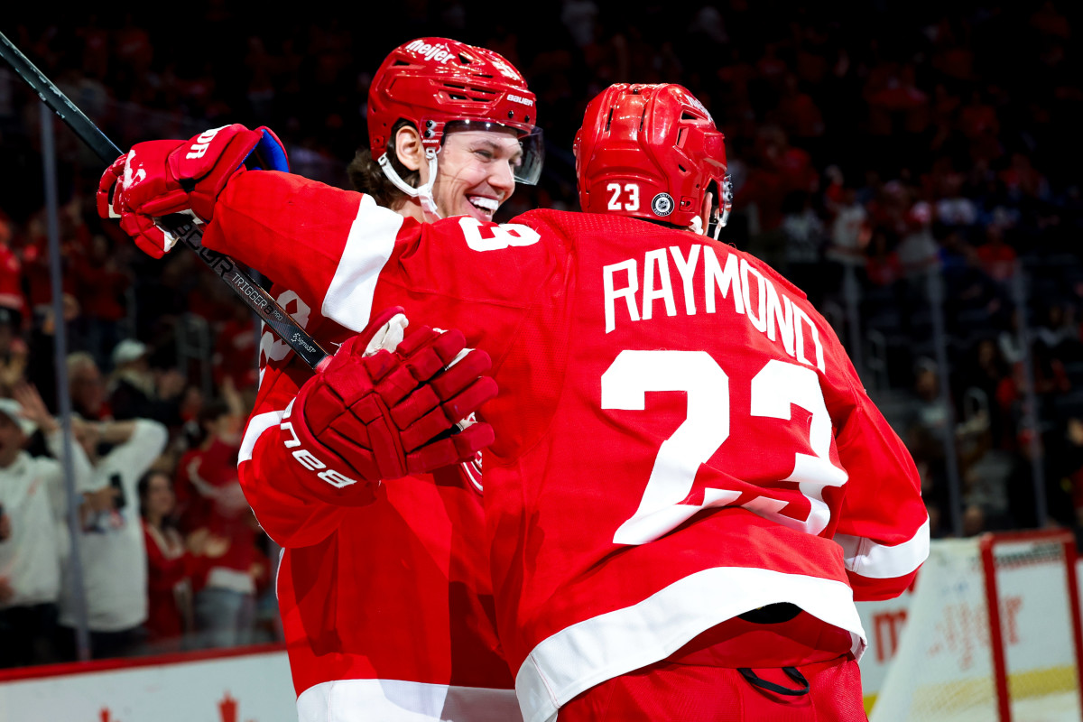 Oct 26, 2023; Detroit, Michigan, USA; Detroit Red Wings left wing Lucas Raymond (23) receives congratulations from defenseman Moritz Seider (53) after scoring in the second period against the Winnipeg Jets at Little Caesars Arena