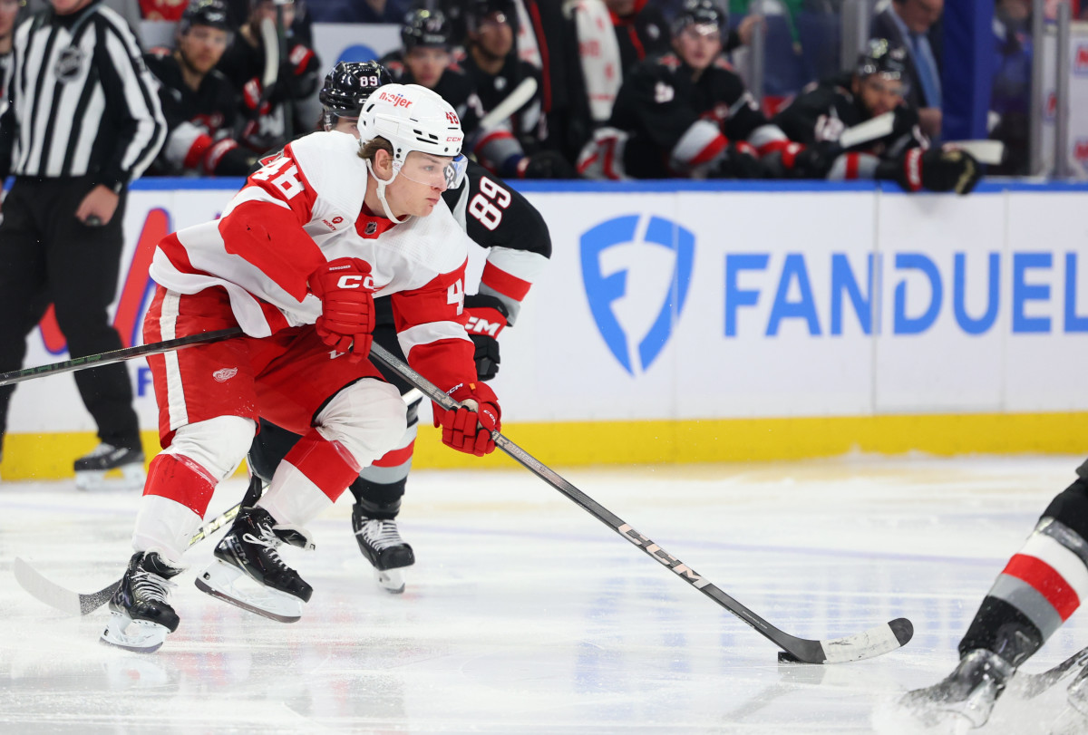 Mar 12, 2024; Buffalo, New York, USA; Detroit Red Wings right wing Jonatan Berggren (48) skates with the puck and looks to make a pass during the third period against the Buffalo Sabres at KeyBank Center