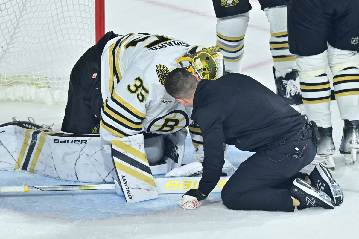 Jan 9, 2024; Tempe, Arizona, USA; Boston Bruins goaltender Linus Ullmark (35) is checked by an athletic trainer during overtime against the Arizona Coyotes at Mullett Arena. Mandatory Credit: Matt Kartozian-USA TODAY Sports