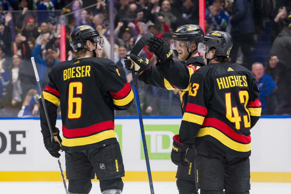 Jan 27, 2024; Vancouver, British Columbia, CAN; Vancouver Canucks forward Brock Boeser (6) and forward Elias Pettersson (40) celebrate Pettersson s game winning goal against the Columbus Blue Jackets at Rogers Arena. Canucks won 5-4 in overtime. Mandatory Credit: Bob Frid-USA TODAY Sports