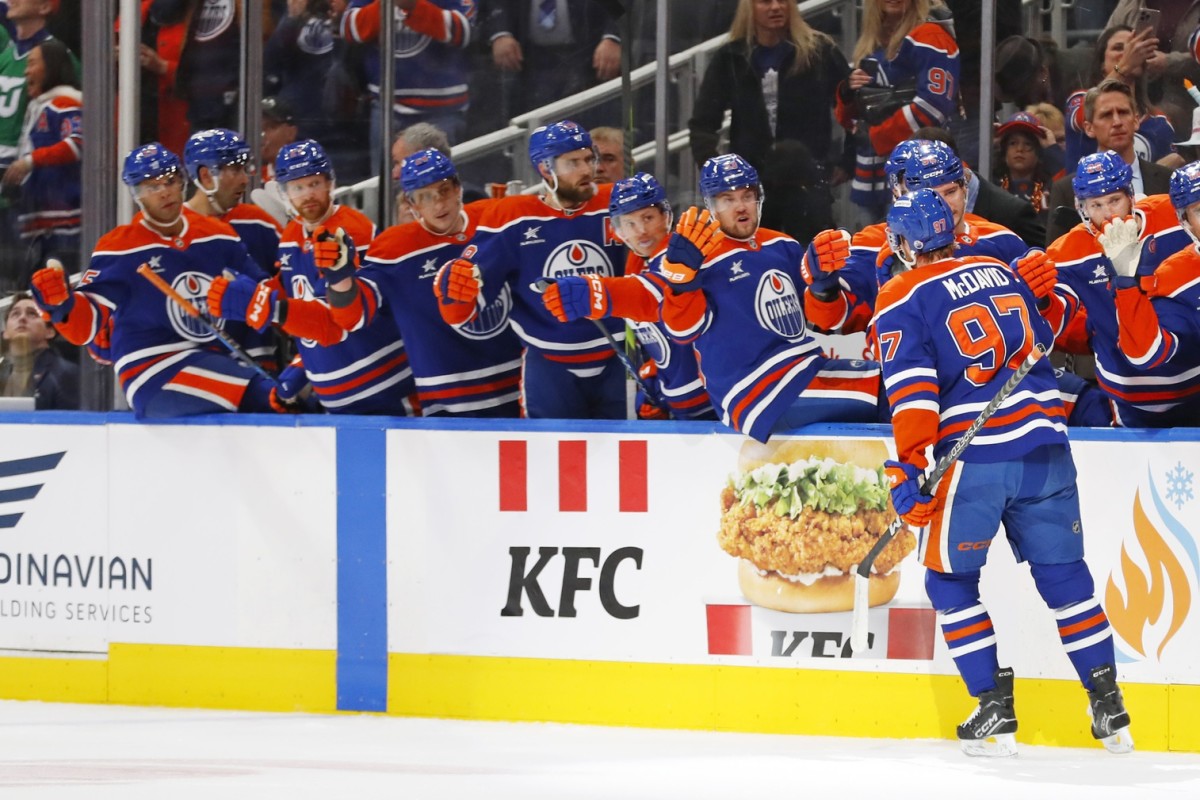 Edmonton Oilers forward Connor McDavid celebrates goal with the team bench.